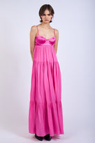 Flowy pink tiered maxi dress for formal evening celebrations.