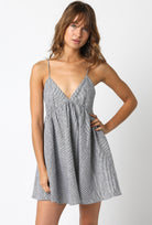Black and white striped 100% linen cami dress with a V-neckline and babydoll fit