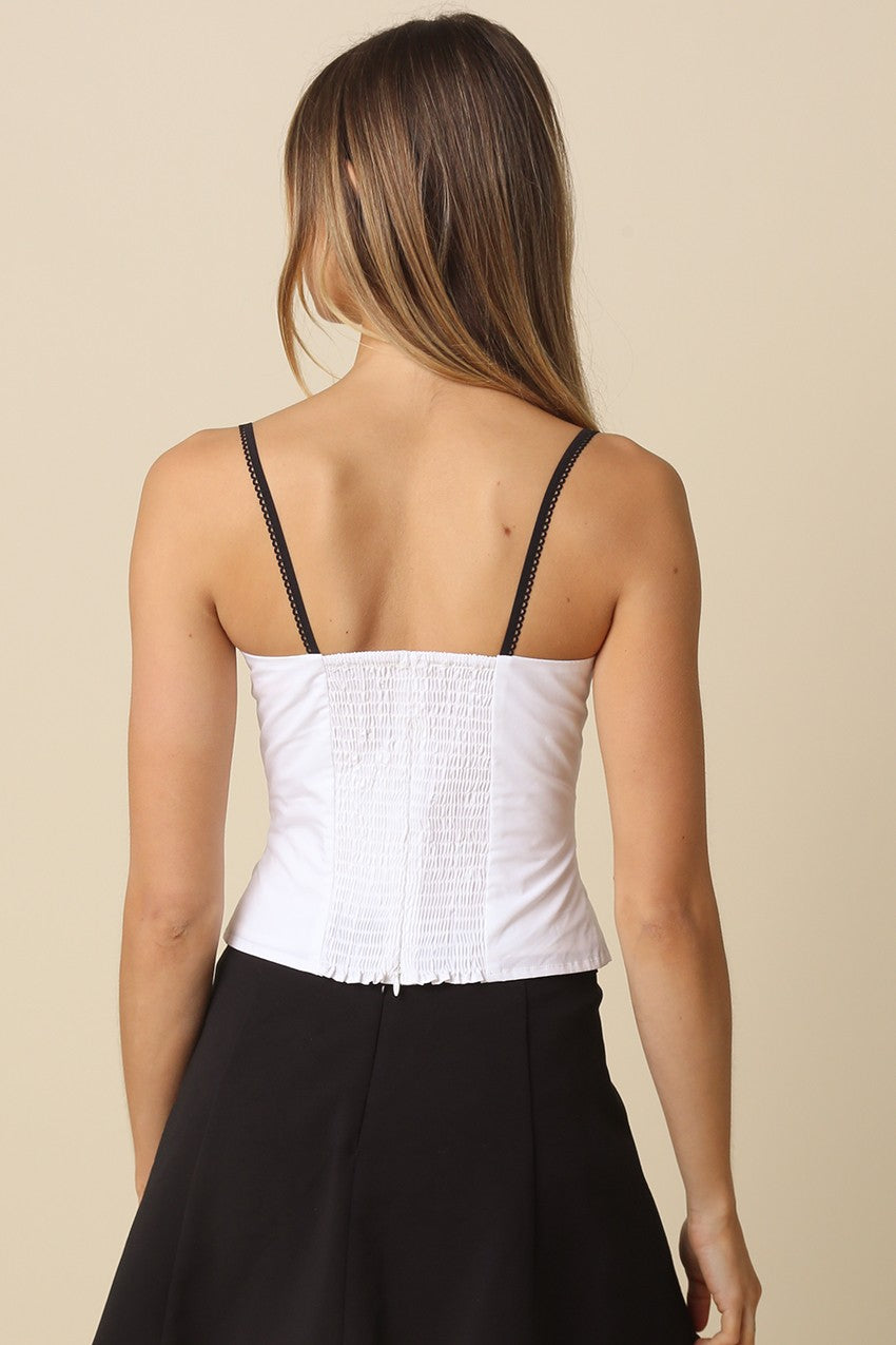 The back of the Devyn top highlighting the stretchy smocked panel and hidden zipper for a comfortable fit