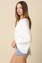 White dolman sleeve knit top with wide sleeves