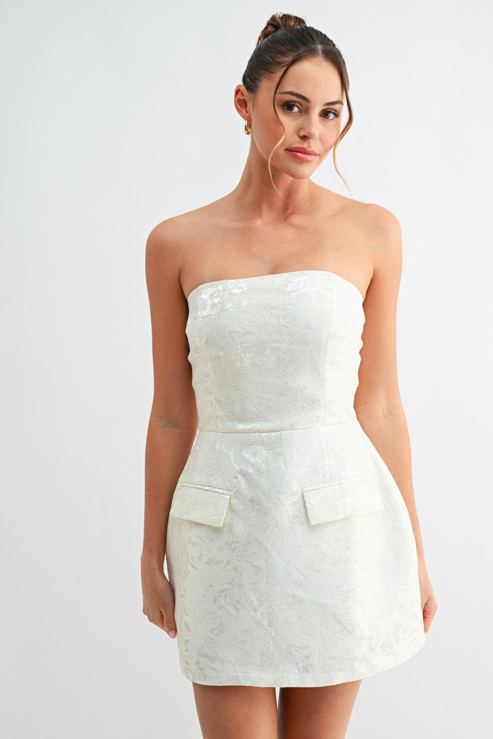 Front view of strapless white jacquard mini dress