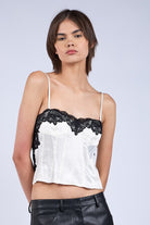 Tasha White Satin Lace Cami Top with black lace trim and adjustable straps.
