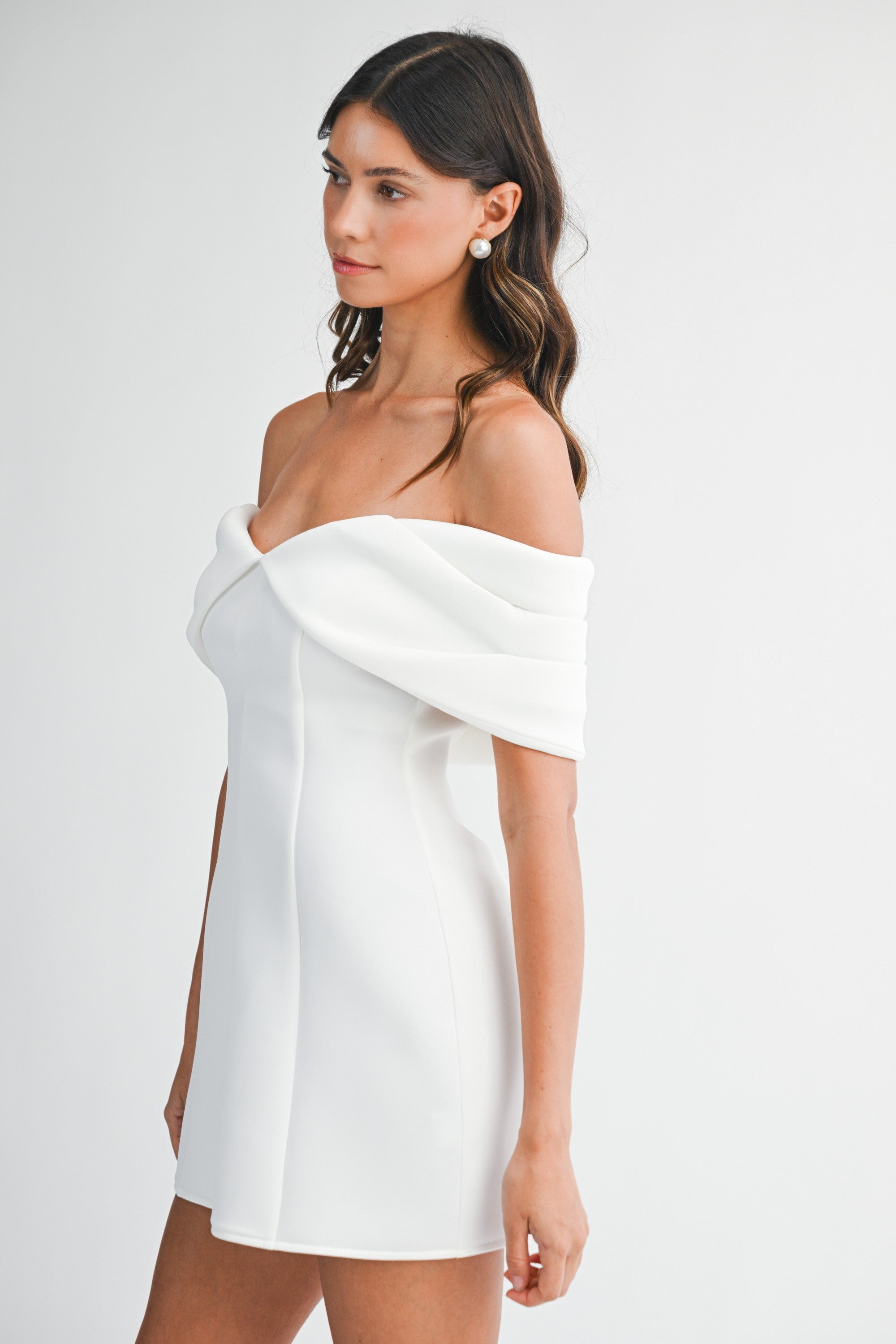 Side view of the Tina mini dress showing the fitted bodice off-the-shoulder nekline
