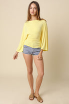 Lightweight yellow dolman sleeve top with relaxed flowy shape