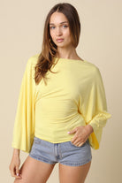Yellow dolman sleeve top for women with adjustable back tie waist