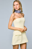 Close-up of side pockets on the Lara light yellow strapless A-line mini dress with shorts